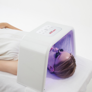client having blue light LED therapy treatment